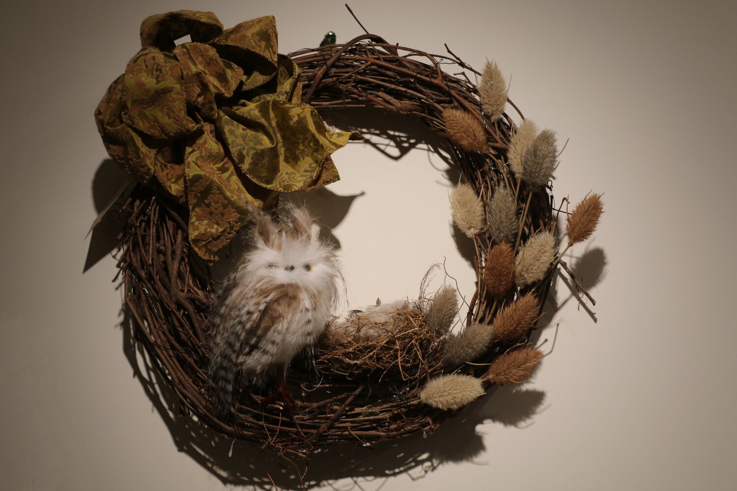 Laura Holden's entry features a stuffed owl and nest.