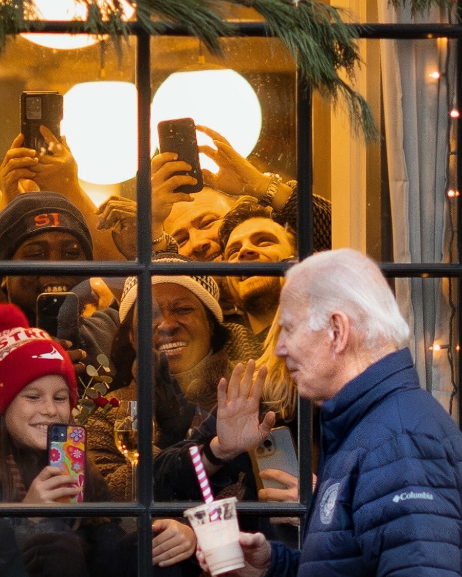 Biden appears to have some fans was he walks downtown.
