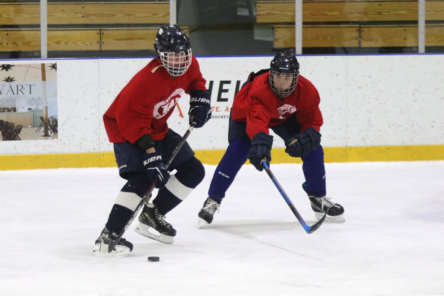 Mike Culkins, left, shields the puck from Brock Beamish at boys hockey practice Monday. The Whalers open the season at home Sunday against Norwell.