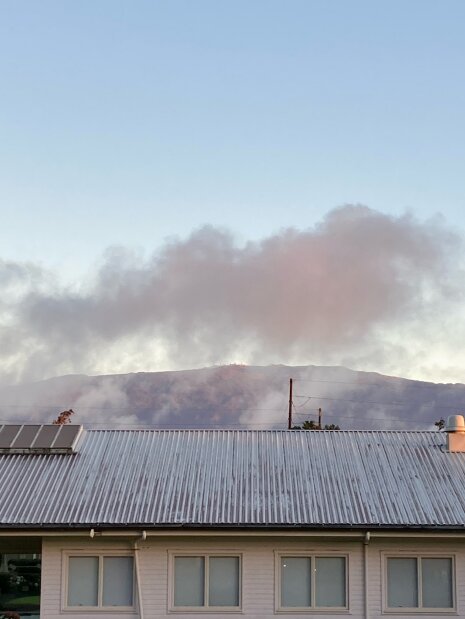 The Mauna Kea summit viewed from Keck headquarters. Five domes are visible through the clouds. From left are the Canada-France-Hawaii telescope, Gemini North, Keck II, Keck I and Subaru.