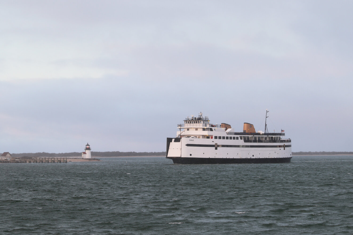 The Steamship Authority’s M/V Eagle makes its way past Brant Point through an empty harbor Tuesday afternoon.