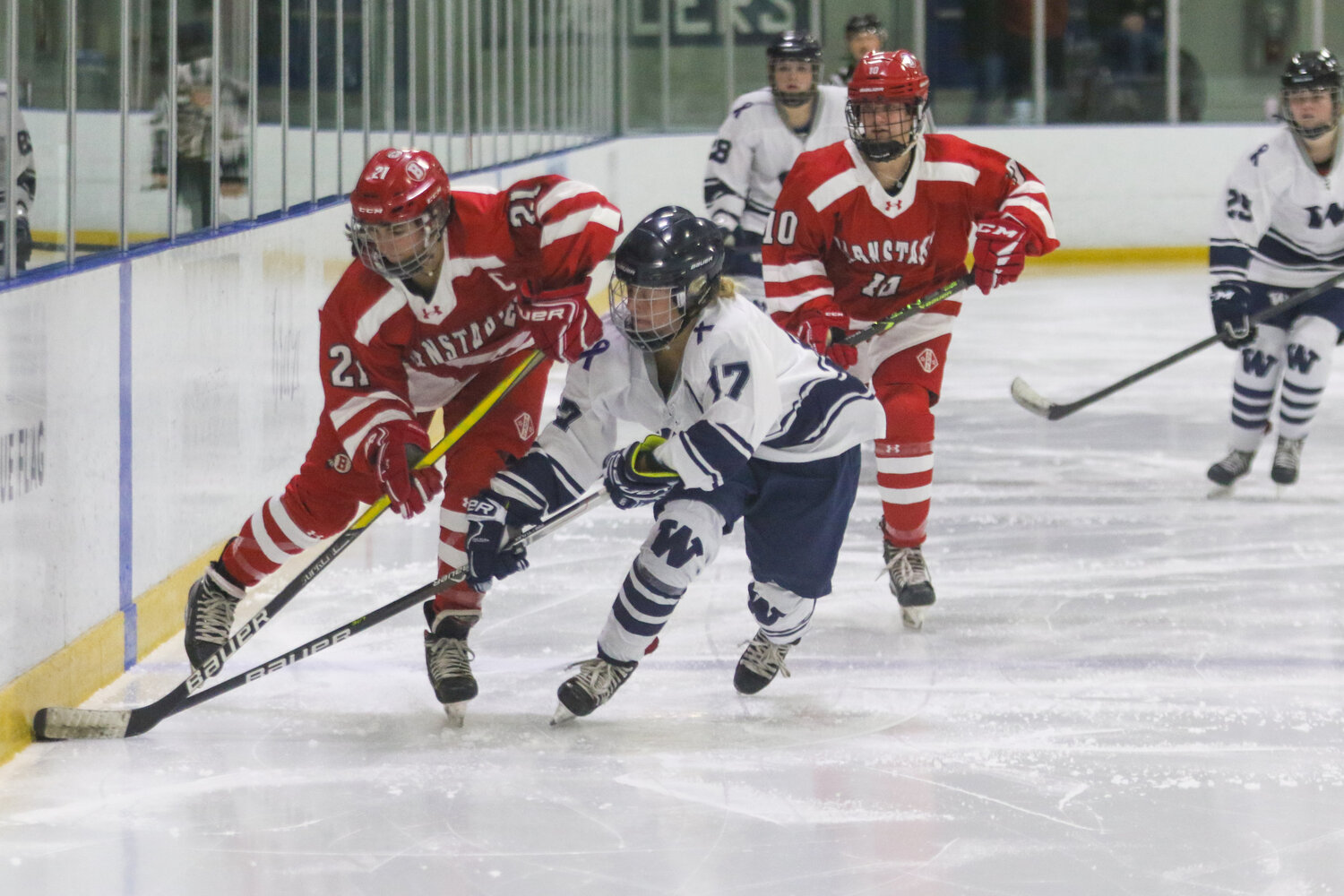 Bailey Lower (17) and a Barnstable player battle for possession during Saturday's game.