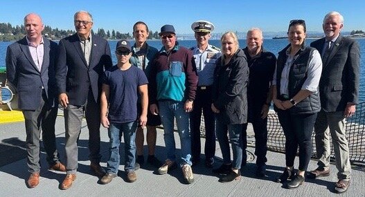 Gov. Jay Inslee, Washington State Ferries Assistant Secretary Steve Nevey, and WSDOT Secretary Roger Millar pose for a photo with WSF employees honored during the 'Life Ring Awards' this year.