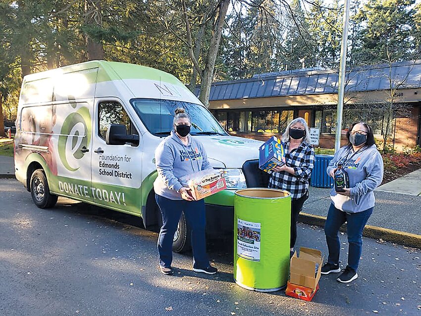 From 2020: Foundation for Edmonds School District members take in donations.