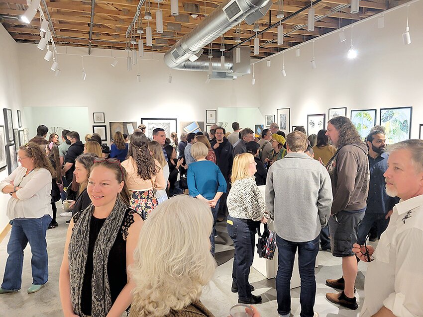 More than 200 people attended a reception for a new exhibit at Graphite Arts Center.