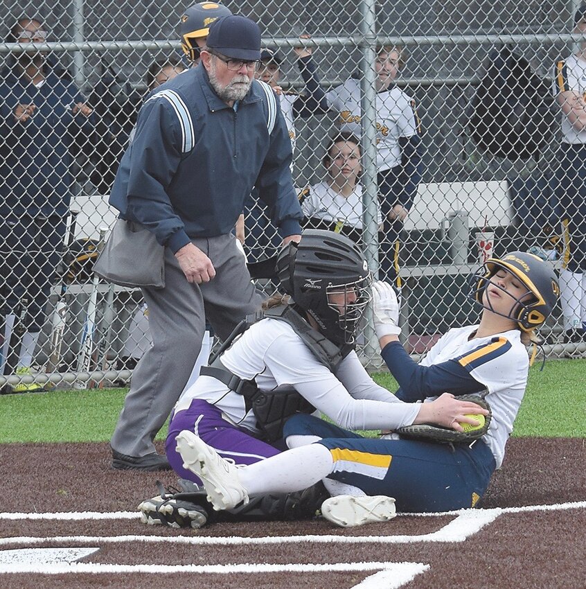 Kamiak catcher Kylie McClure tags out Mariner’s Sammie Bruton at home plate.