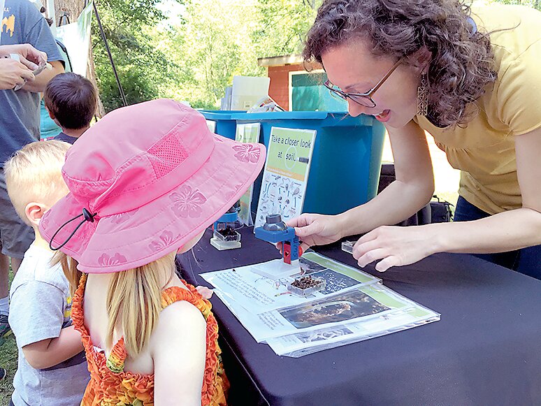 Children learn about Puget Sound at a previous fair.