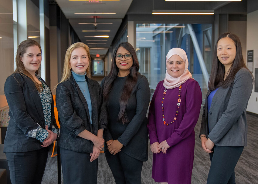 Edmonds College’s Computer Science and Robotics and Artificial Intelligence faculty includes Allison Obourn (CS faculty department head), Dr. Carey Schroyer (dean), Dr. Ishaani Priyadarshini (faculty), Dr. Sirine Maalej (ROBAI faculty department head), and Charlene Lugli (faculty). Faculty members Dr. Julio Garibay, Niko Culevski, and Maria de Zuviria-Padlock are not pictured.