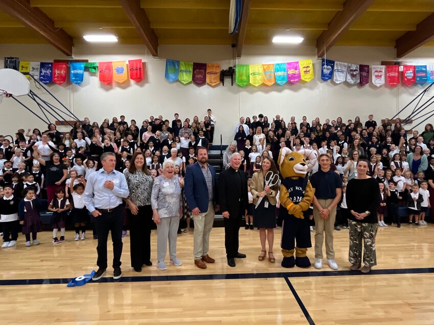 From left: Dr. John Hoag; Councilmember Michelle Dotsch, former Edmonds Mayor Barb Fahey; Edmonds Chamber of Commerce President Ryan Crowther; Holy Rosary Pastor Matthew O'Leary, Edmonds Chamber of Commerce President Ryan Crowther; Father Matthew O’Leary, Principal Larkin Temme; Rocky the Ram; Holy Rosary student Jared Petras; and Chamber Membership Director Erica Sugg. (Photo courtesy Holy Rosary Edmonds School)