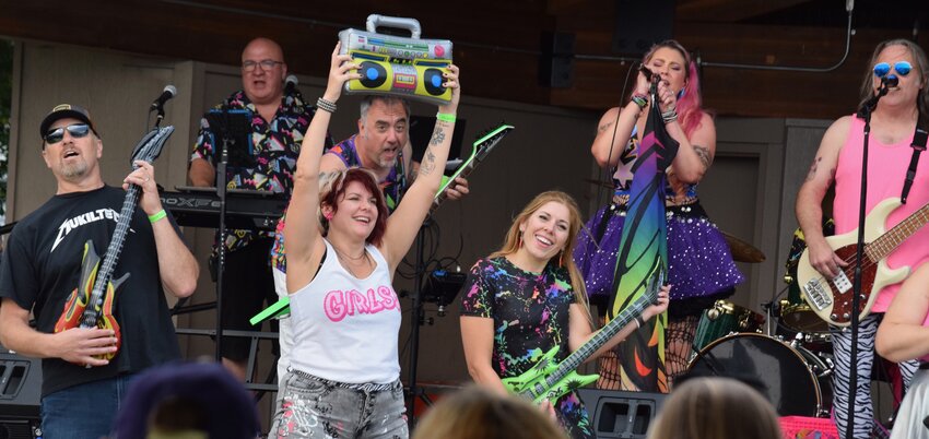 Jackie and the Holograms encourage the audience to get up and join the show Sept. 7 on the main stage.