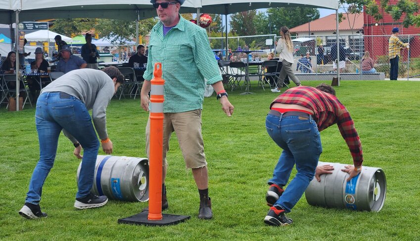 Jeff Barnett signals the start of another keg race. (Photo by Brian Soergel/Edmonds Beacon)