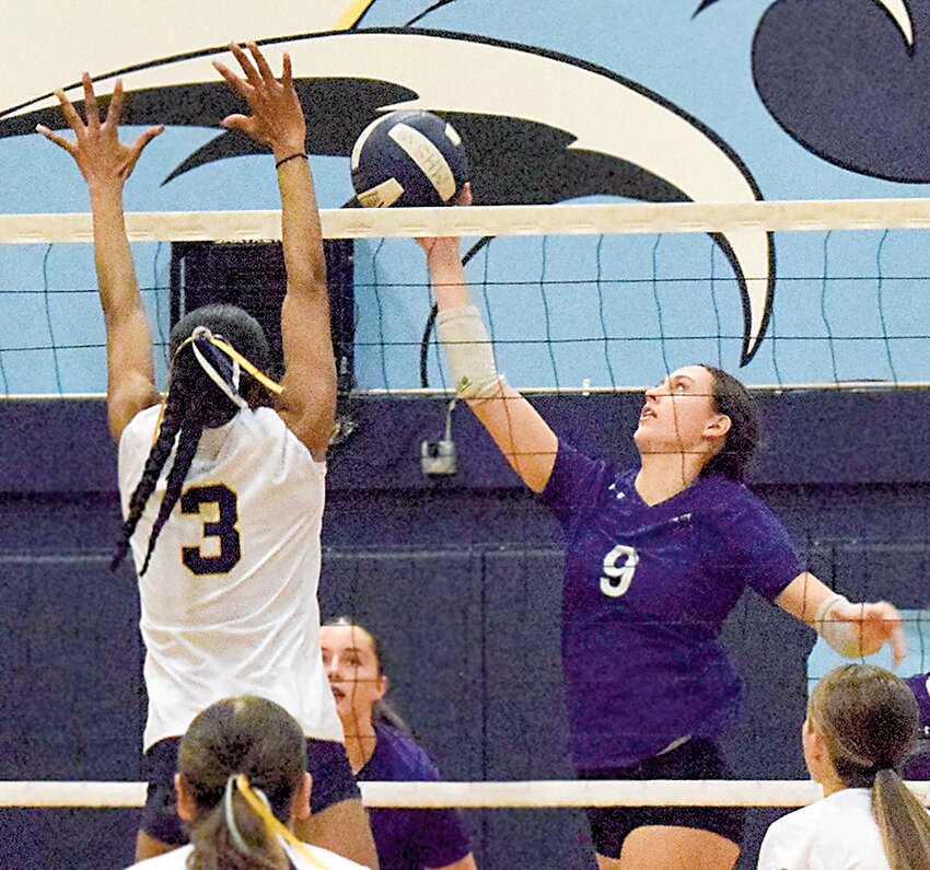 Kamiak’s Marlo Kyle smashes the ball against Mariner’s Amoni Watson.