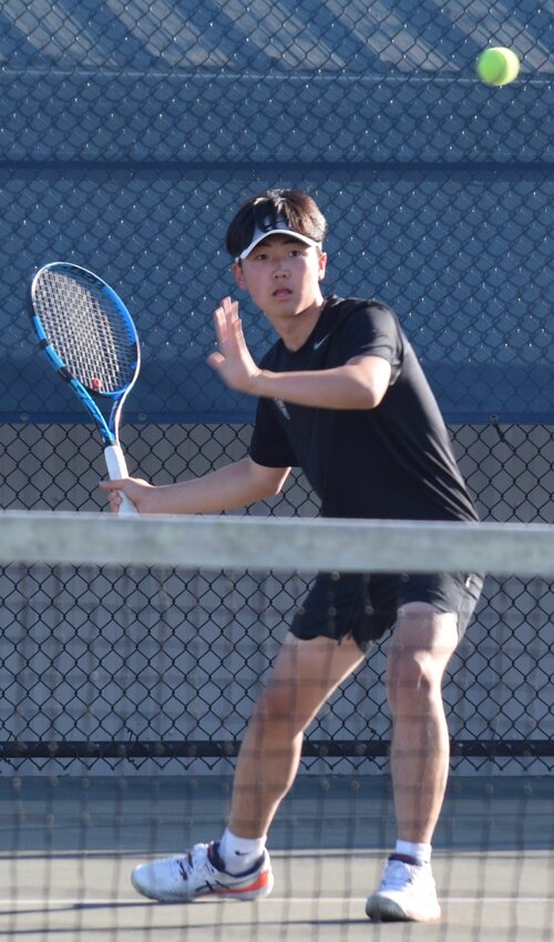 Kamiak’s Daniel Kim focuses on the ball during an exhibition match with Mariner’s Brian Truong Le Oct. 3 at Mariner High School. The Knights won the regular season match 6-0.