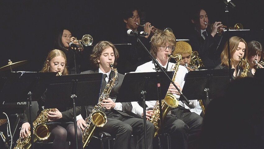 Dance instructors Ben White and Ariel Goh (far right) demonstrate some swing dance moves at the Kamiak High School Jazz Band’s annual Big Band Dance Feb. 28 at Rosehill Community Center.