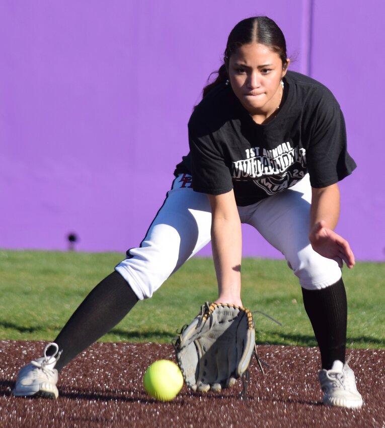 Kamiak’s Synclair Mawudeku fields a ball in the infield.