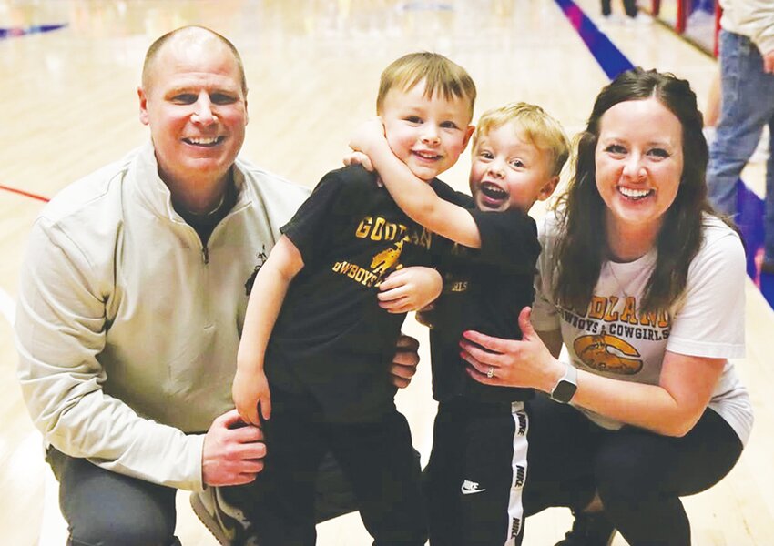 From left to right it is, Coach Mike Doll, sons, Grayson and Jordan and wife/mom Marissa Doll.