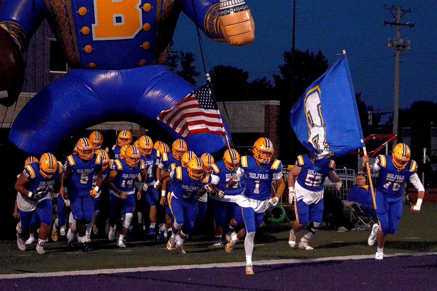 The Bolivar Liberators race onto the field for the last regular game of the season, Deacon Sharp and Kaden Degraffenreid leading the charge.