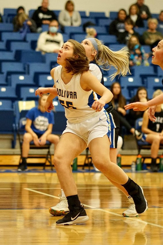 Sophomore Cora Roweton eyes a rebound under the basket during Bolivar&rsquo;s win over Marion C. Early on Monday, Jan. 11.&nbsp;