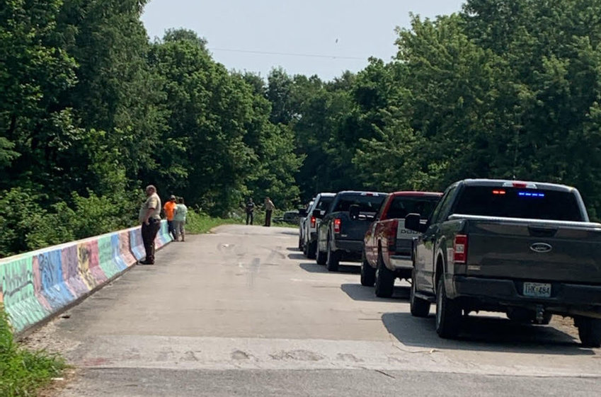 Emergency responders, including the Missouri State Highway Patrol Marine Division, search for a missing man at Sunset Bridge, southeast of Bolivar.&nbsp;