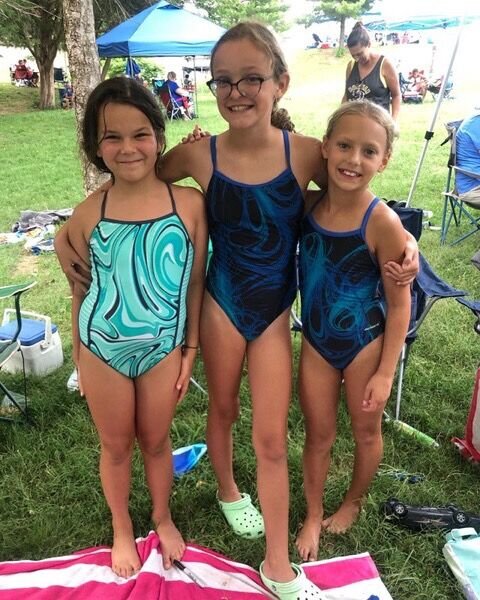 Palynn Inman, Lilly Daulton, Adalyn Jump are all smiles at the championship meet.