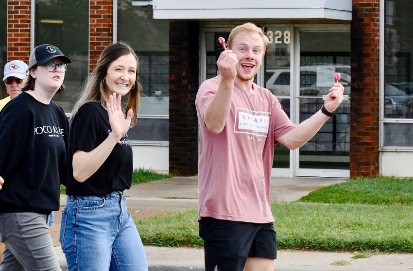 Senior Lily Crowder and leaders Sarah Creasey and Sam Lewright walk the route through Bolivar with KLife and bring smiles and candy to all along the way.