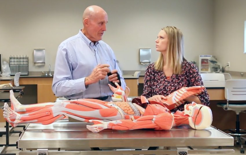 Dr. Bill Gray explains the new full body models in the Anatomy and Physiology lab to Kayla Hendricks, MSN, RN.