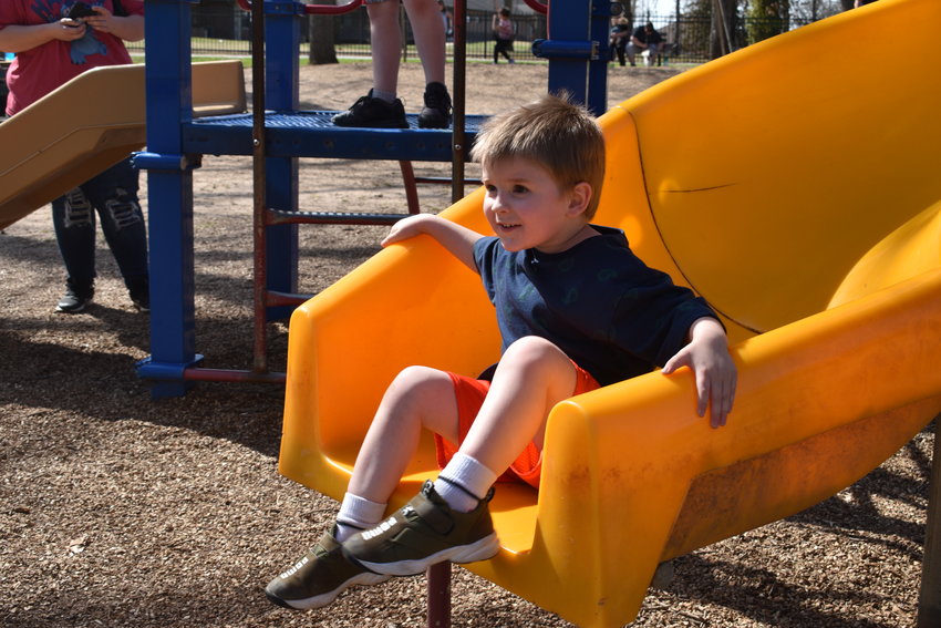 Pictured here, Charlie Cline, age 3, flashes a smile as he enjoys the park&rsquo;s playground equipment with his brother TJ Cline and mom Bre Cline.