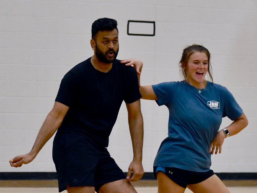 Dancers Shanil Patel and Riley Ross working on their moves during a group practice at the high school Wednesday, March 30.