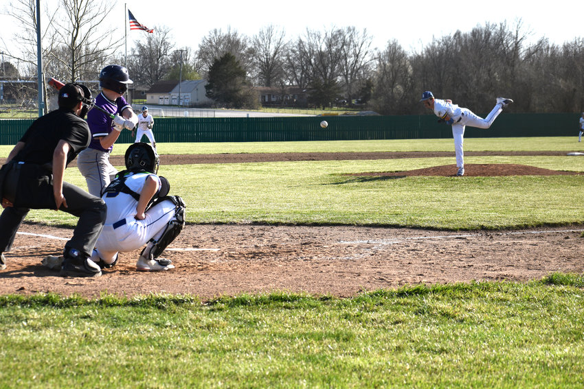 Senior Luke Goforth slings the ball toward home plate during his one-hit complete game Friday, April 1.