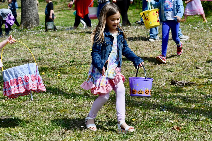 Clarcy Griswold moves quickly and has her basket ready to load up during the Easter egg hunt.