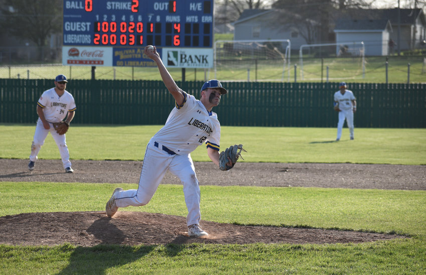 Pitcher Cooper Cribbs fires a pitch toward home plate in the top of the 7th inning.