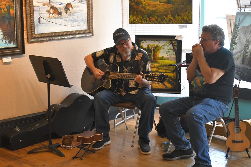 Shawn Hunter and Mark Sparks &mdash; of the duo &ldquo;Sparky and Hunter&rdquo; &mdash; provide musical entertainment for the visitors at the Artabilities Art Show on Saturday, April 30.