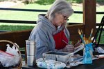 Sandy Divin has a prime spot in the square&rsquo;s gazebo as she paints the Hair, Heart and Soul Salon on South Springfield Avenue at the association&rsquo;s first Plein Air event.