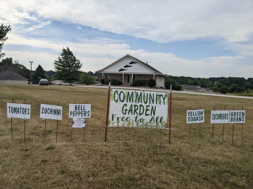 The Seventh Day Adventist Church advertises its community garden to travelers along Highway D and Division St.