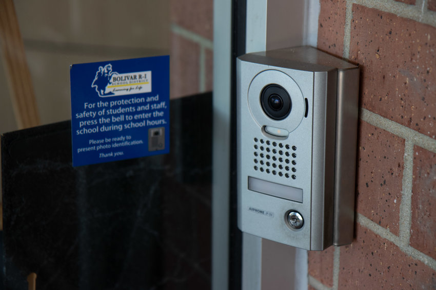 Door access systems require visitors to check in at the main offices before attempting to enter school buildings.