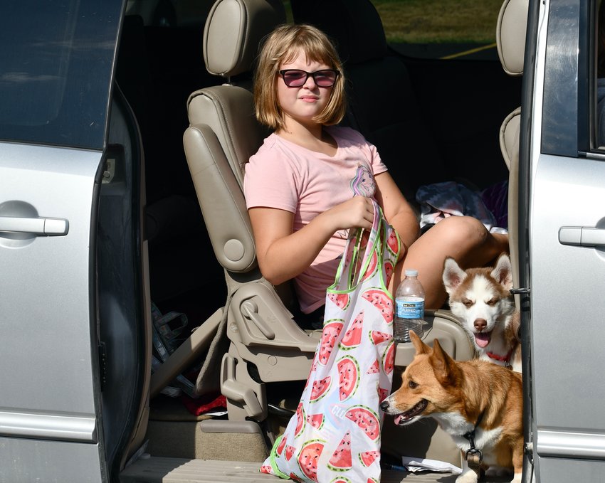 Avis Groves, accompanied by pals Daisy and Ana, made her way through the pick-up line to gather lots of great items for her back-to-school bag.
