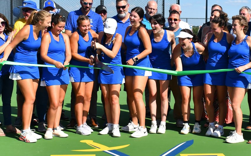 Some excited senior Lady Liberators and a big pair of scissors were the perfect match for a stubborn ribbon at the Tuesday, Sept. 20, ribbon cutting at the new tennis courts.