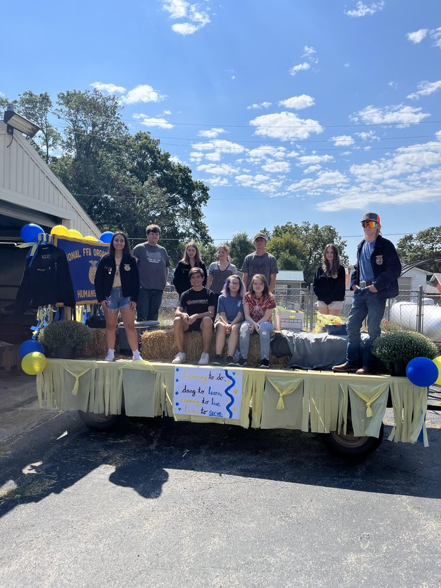 FFA members bask in their hard work on their parade float.
