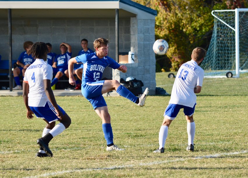 Senior Jason Poterbin sends the ball flying past a Hillcrest player.