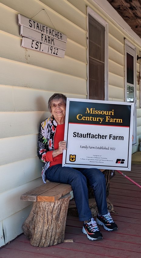 Proud of her family&rsquo;s 100-year legacy, Virginia Stauffacher displays the Missouri Century Farm sign for Stauffacher Farm.
