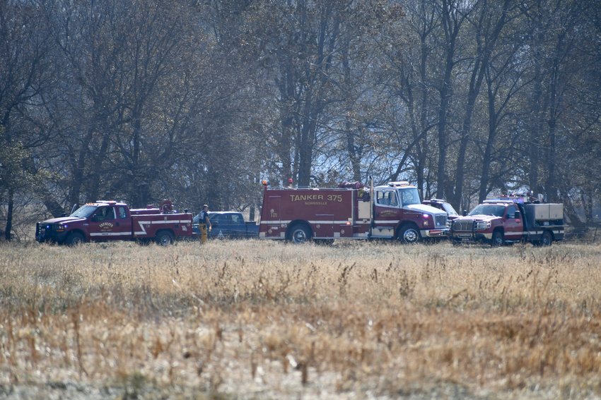 Firefighters from surrounding counties respond to a fire near Bolivar on Sunday, Oct. 23.