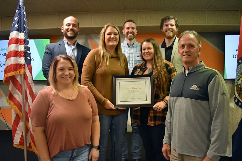 Bolivar Area Chamber of Commerce President Paul Folbre and Vice President Jake Wilson are pictured with the 2022 Community Partner of the Year Award to Todd Schrader, Shania Francka, Shawna Cheney and Hannah Vodicka from Bolivar Parks and Recreation. Also pictured is Micah Titterington of Community Outreach Ministries, the 2021 winner. This award is given each year to a service group that goes above and beyond to support the community.   STAFF PHOTO/LINDA SIMMONS