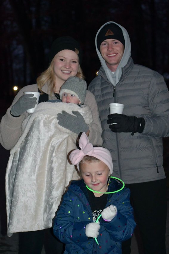 Tracy and Joey Vote with daughter Ella and niece, Tinsley Bauer, came prepared to stay warm while enjoying all the sights.   STAFF PHOTO/LINDA SIMMONS
