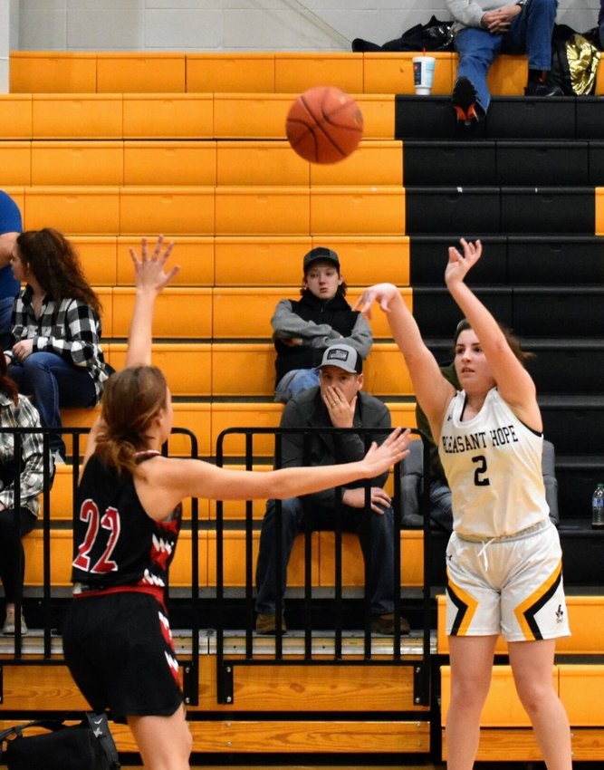 Lady Pirate #2 Senior Kylie Tucker shoots a three pointer during the Thursday Dec. 15 game against Hurley. Pirates won 61-38.   STAFF PHOTO/MIKE KOOTZ