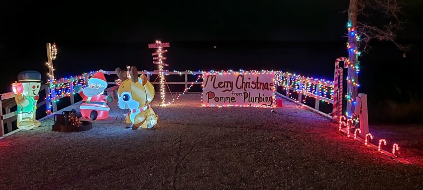 An area business brings holiday spirit to Pomme de Terre Damsite Park at the Light the Lake event.