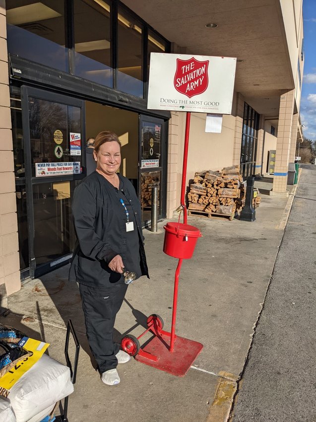 Laura Miller, a nurse at Polk County Health Center, offers her time as a bell ringer for the Red Kettle Campaign at Woods Supermarket. Through the campaign, the community can donate money to support local families. Volunteers are needed to fill bell ringing shifts by signing up online at bolivarcom.org/bellringing.