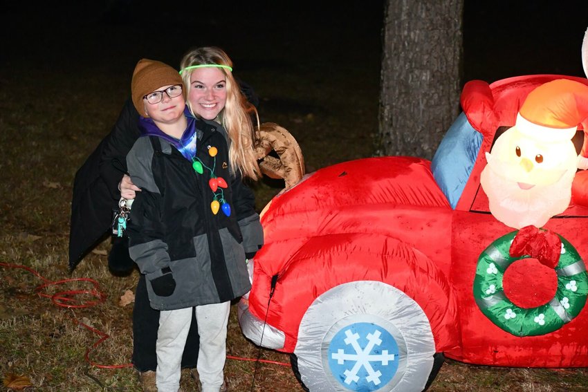 The weather outside wasn&rsquo;t frightful for the annual Kiwanis Club Glow Walk, Sunday, Nov. 27,&nbsp; and Kaden Swearingin was all smiles getting his picture taken with Santa and Riley Ross.   &nbsp;   STAFF PHOTO/LINDA SIMMONS