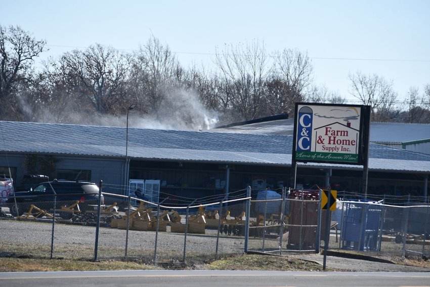 Wisps of smoke filter out of C&amp;amp;C Farm&rsquo;s warehouse after the fire is subdued.