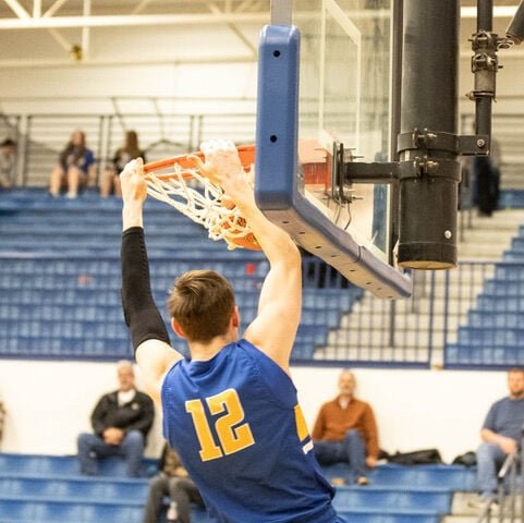 #12 Kyle Pock sets the tone against Helias early in the game on Saturday, Jan. 28.   STAFF PHOTO/BOB CAMPBELL