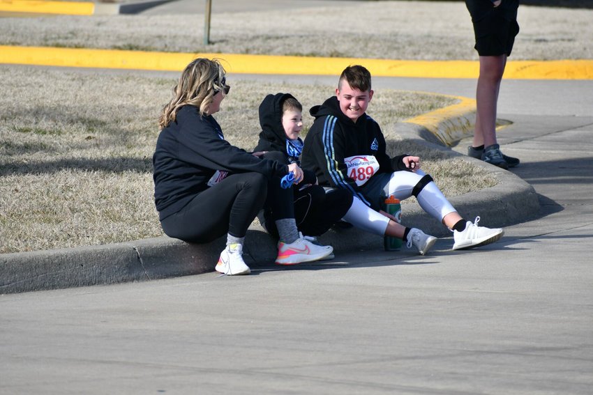 It was slightly chilly for the runners at the Polar Bear Run, Saturday, Feb. 18, but Jenni and River Williams caught up with Luke Thomas afterward and didn&rsquo;t notice it being too cold.   STAFF PHOTO/LINDA SIMMONS